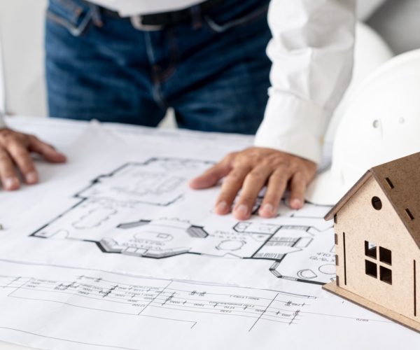 high-angle-architect-checking-project